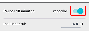 Pantalla del asistente de bolo en la aplicación Beetis. El interruptor 'recordar' está resaltado para programar un recordatorio de inyección de insulina.